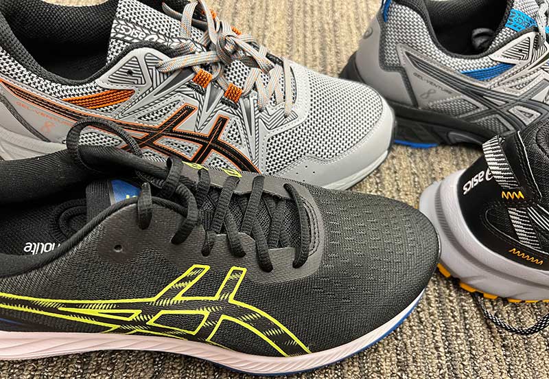 Four Pairs of Asics Shoes