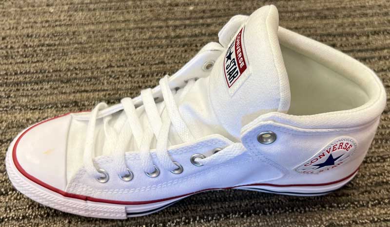 White Converse All Star Shoe on Floor